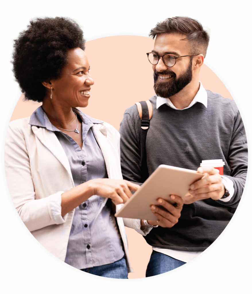 Two people looking at tablet together