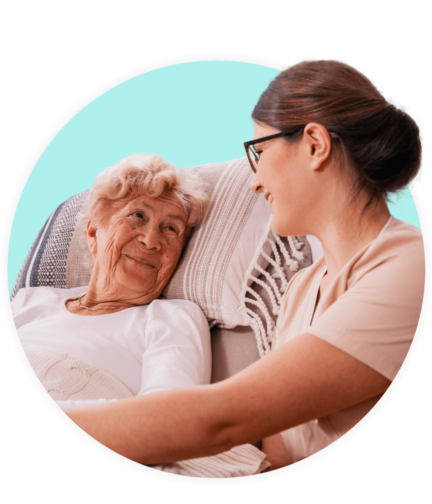 Norse caring for elderly woman, smiling